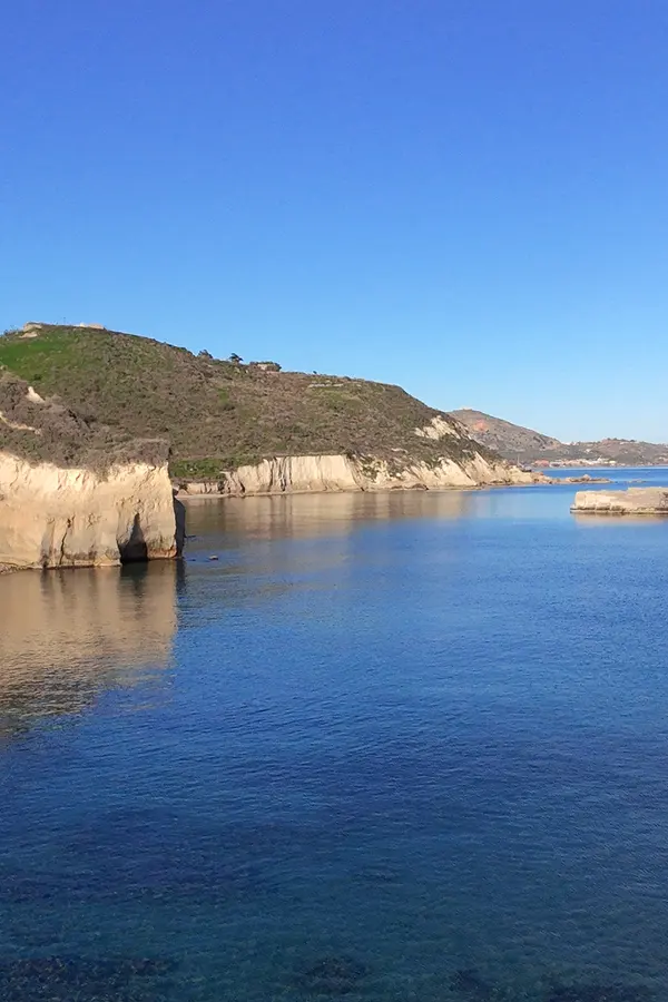 Sandy cove and clear turquoise waters at Kera beach, offering a secluded escape on the Mediterranean coast of Crete.